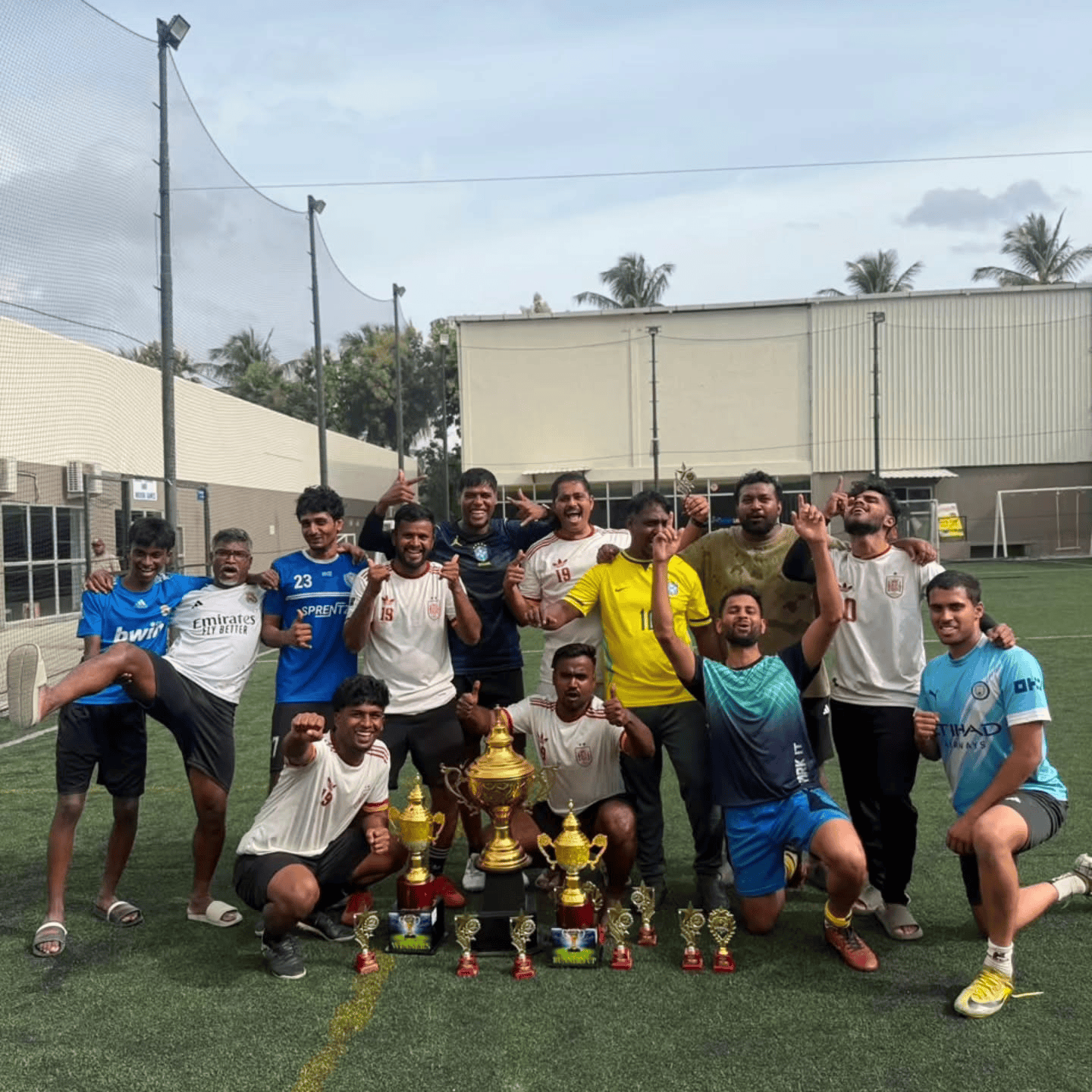 Players celebrating with a trophy at the Golden Baby League